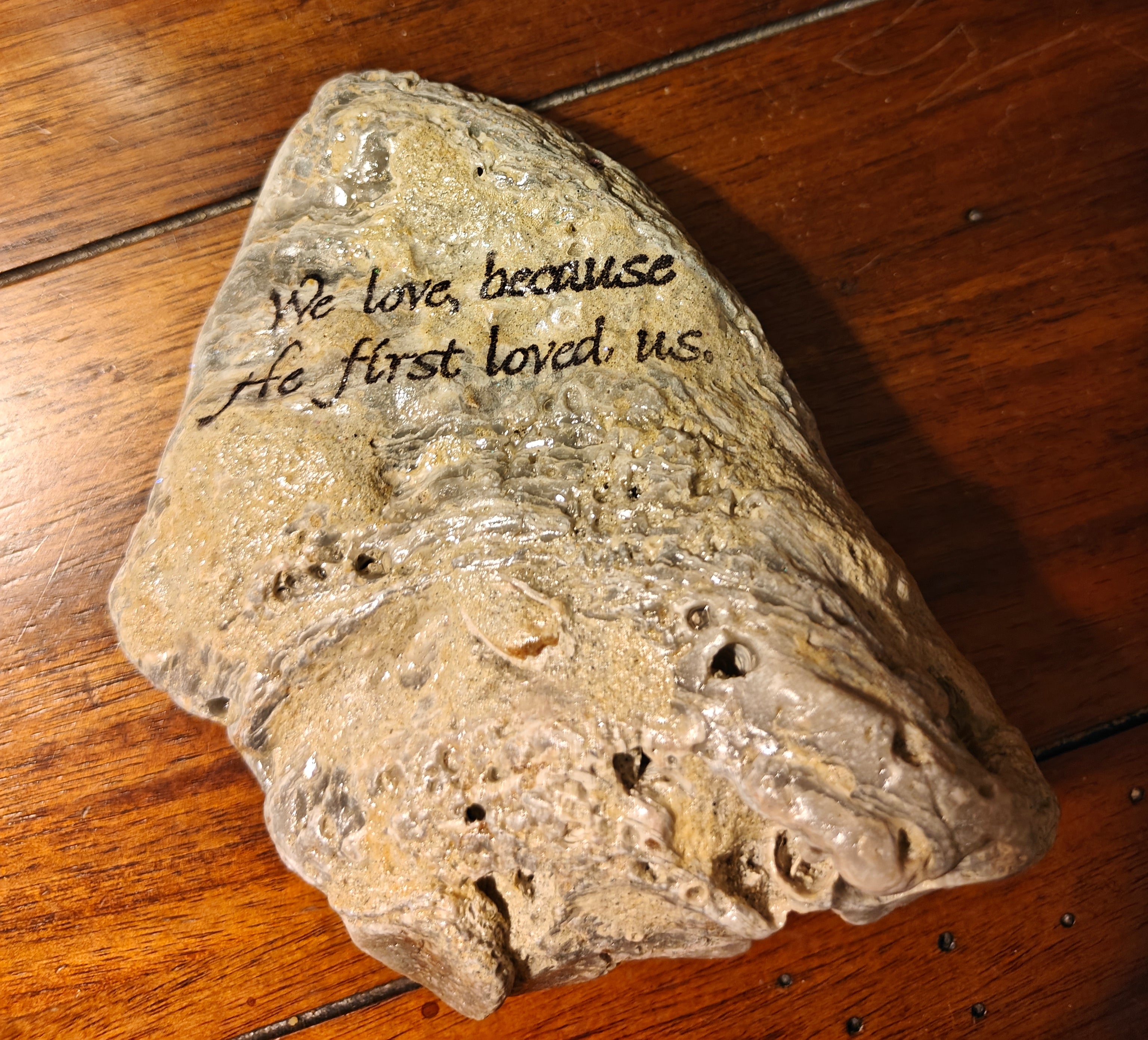 "We love because he first loved us", decorative shell