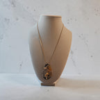 Wire-Wrapped Natural Yellow & Black Swirl Stone Cross Pendant