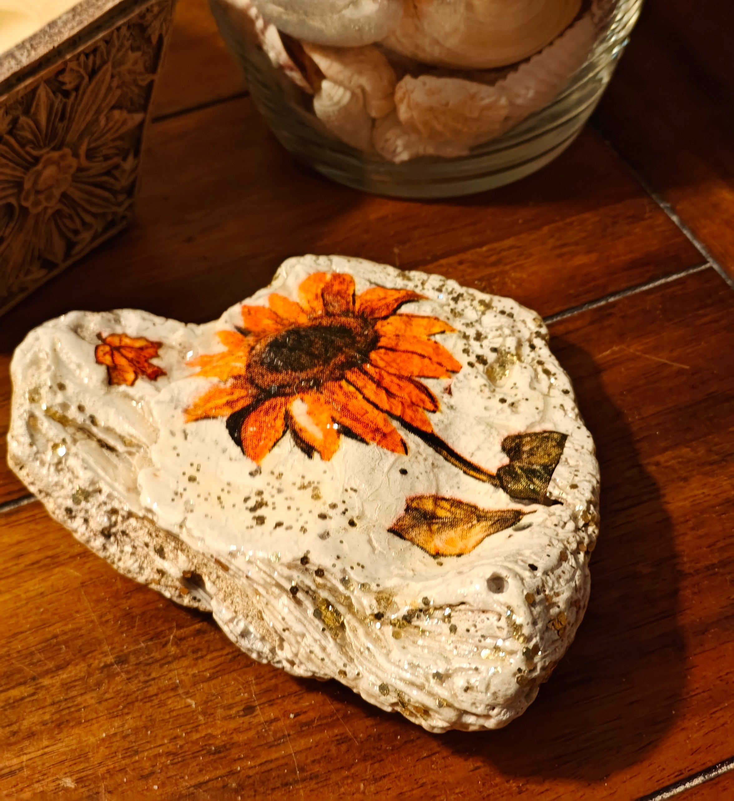Beautiful hand-decorated shell featuring a sunflower design