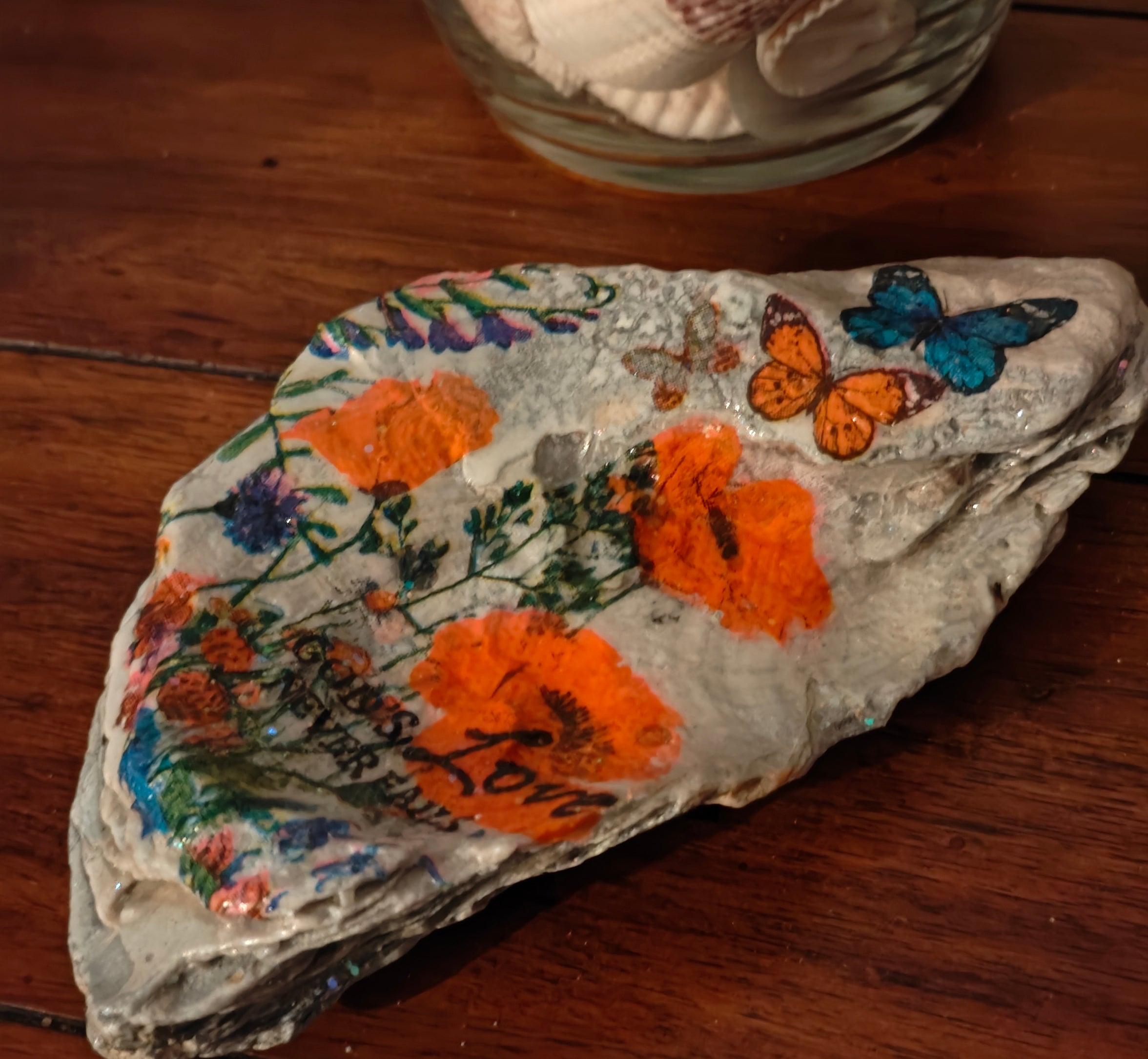 God's Love Never Fails" Hand-Decorated White Shell – Orange Floral & Butterfly Decor