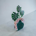 "Friends are the Family You Choose" Faux Plant Decor – Turquoise Wooden Pot with Pink Rose Bow