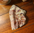 "We love because he first loved us", decorative shell