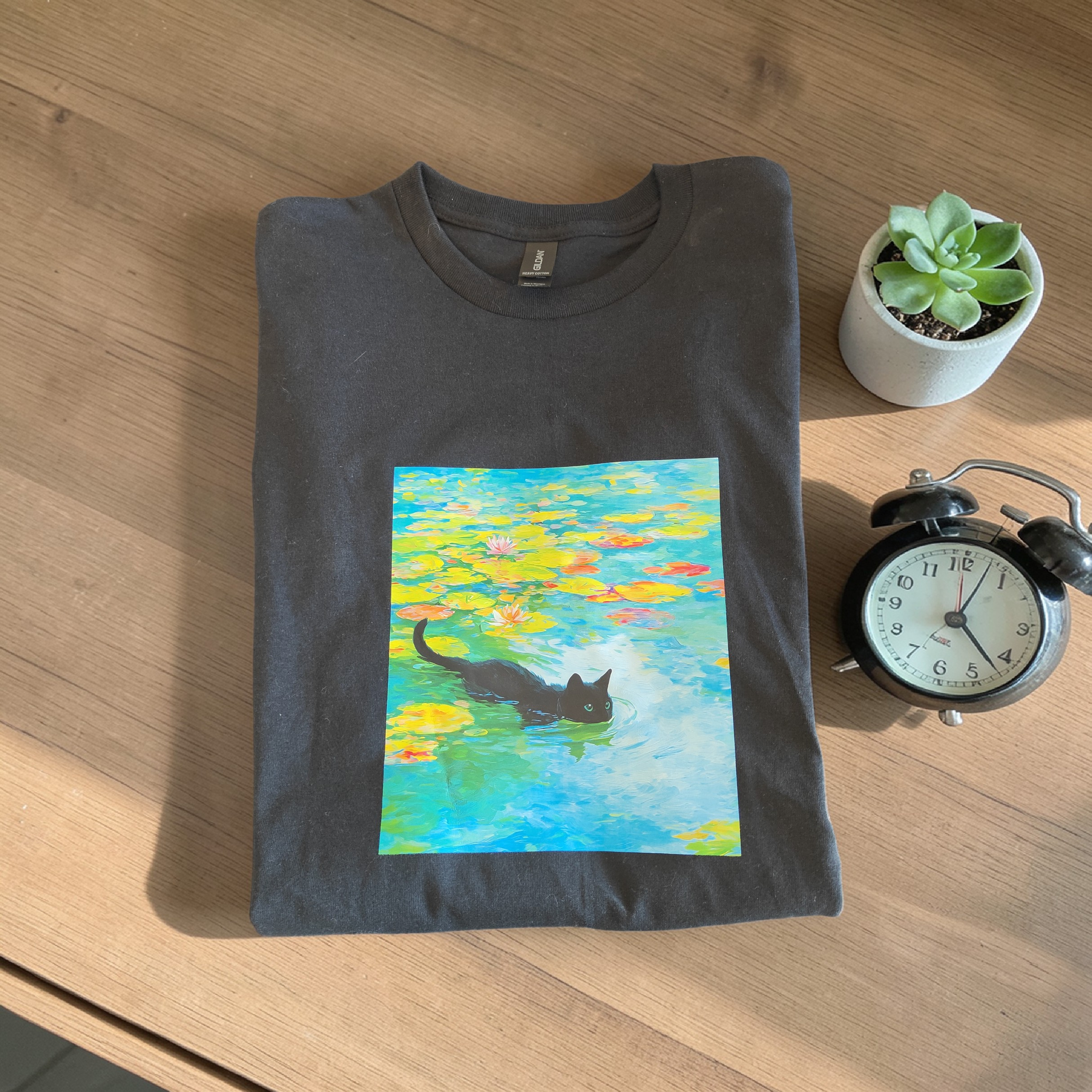 "Swimming Cat in Lily Pond" Women’s Black Cotton Tee – Size Large – Artistic Graphic