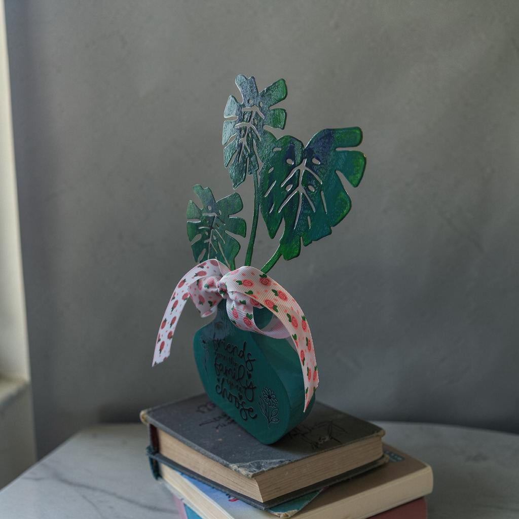 "Friends are the Family You Choose" Faux Plant Decor – Turquoise Wooden Pot with Pink Rose Bow