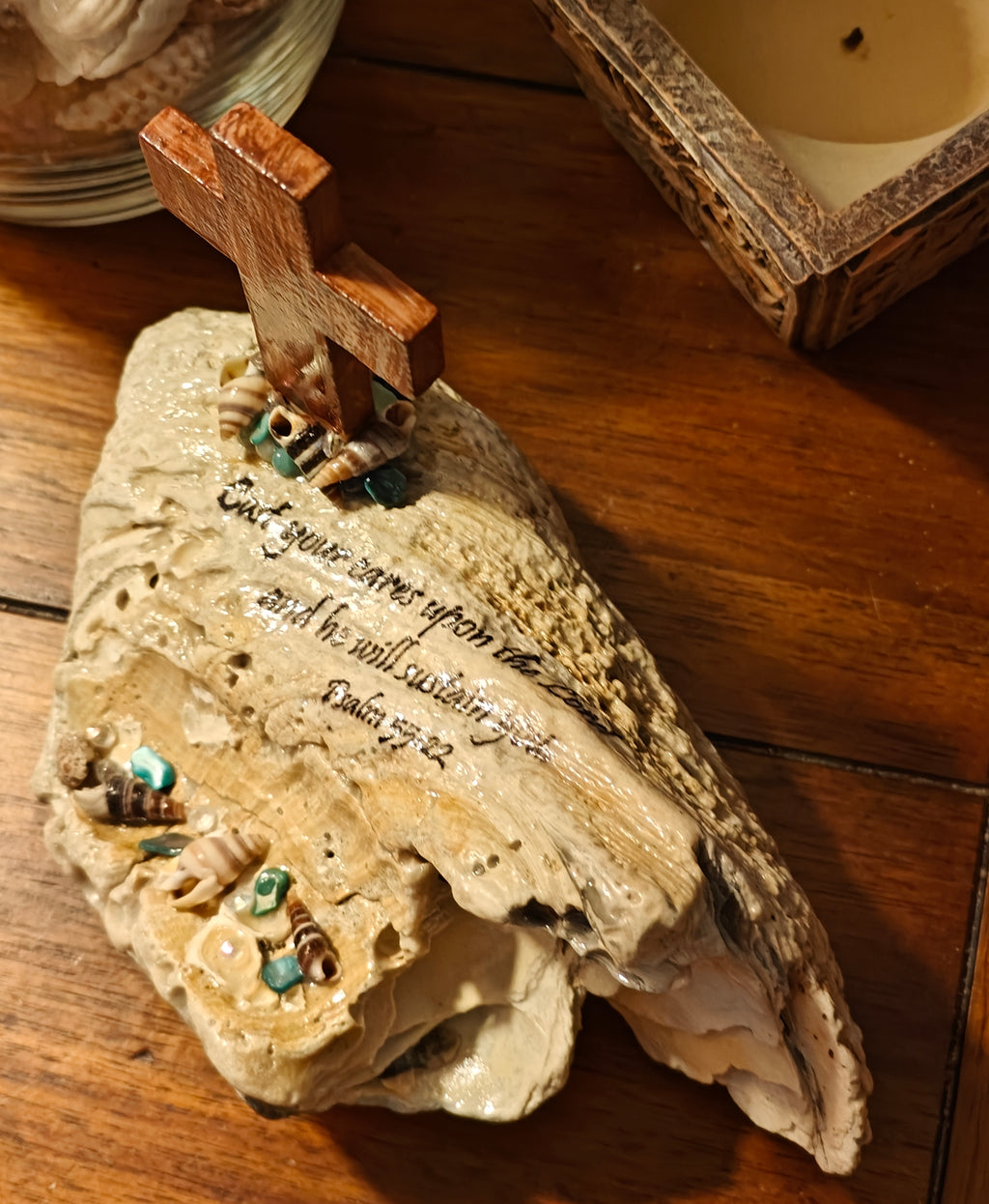 "Cast your cares upon the Lord and he will sustain you" beach scene with cross shell