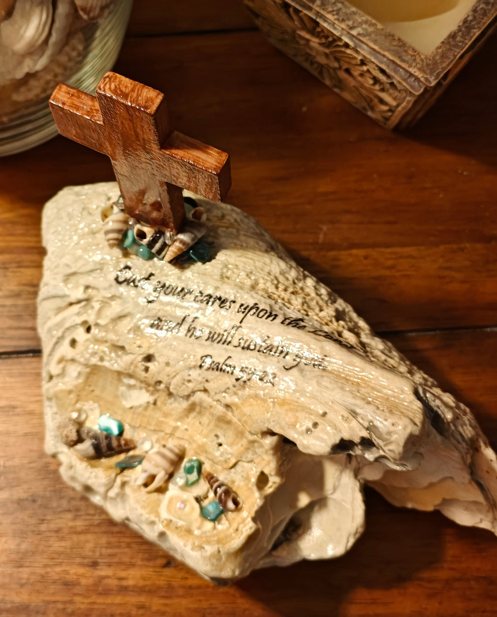 "Cast your cares upon the Lord and he will sustain you" beach scene with cross shell