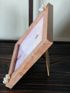 “Framed pastel print of Jesus walking on the water.