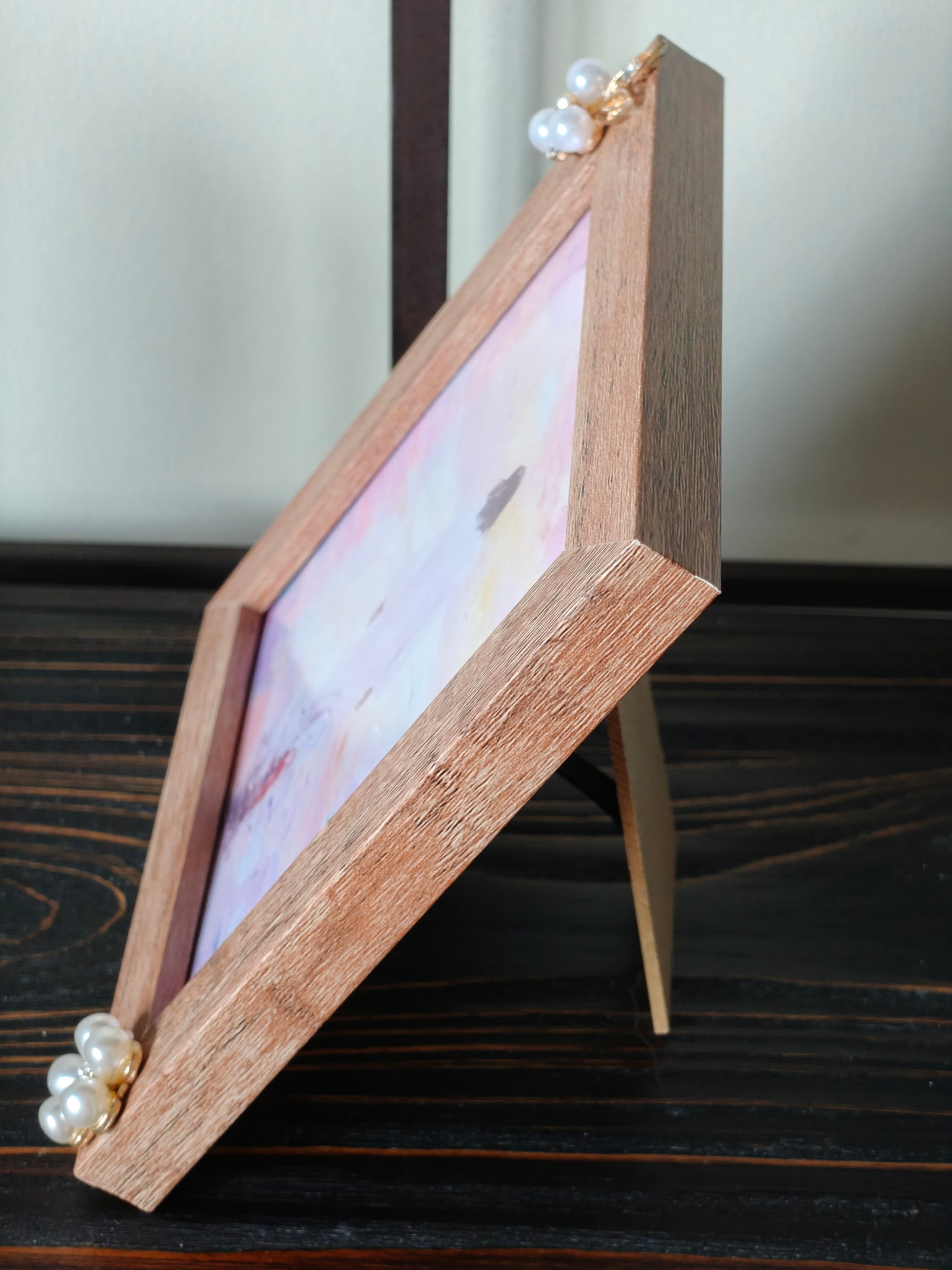 “Framed pastel print of Jesus walking on the water.