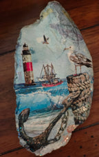 Hand-decorated shell featuring a lighthouse