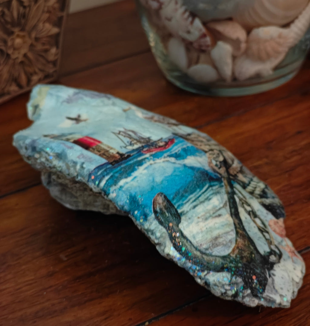 Hand-decorated shell featuring a lighthouse