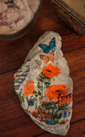 God's Love Never Fails" Hand-Decorated White Shell – Orange Floral & Butterfly Decor