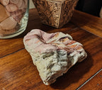 "We love because he first loved us", decorative shell
